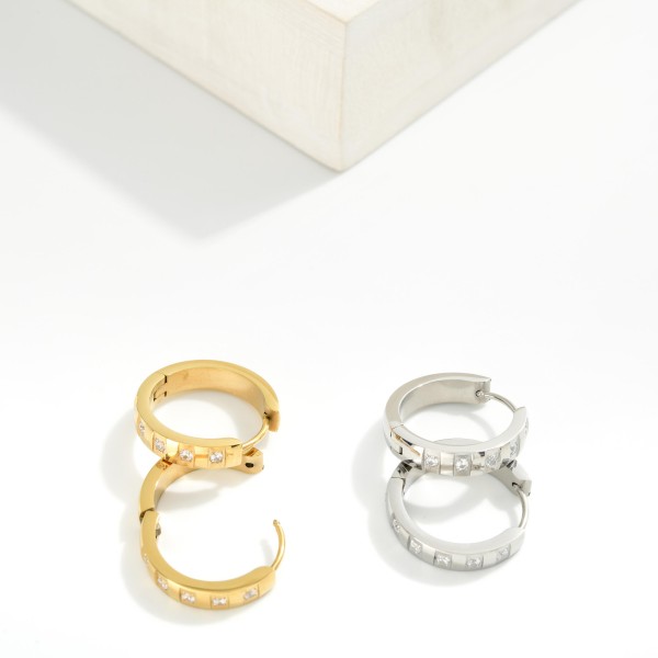 Metal Tone Hoop Earrings Featuring Rhinestones Details 

- Stainless Steel
- Water Resistant
- Approximately .75" D
