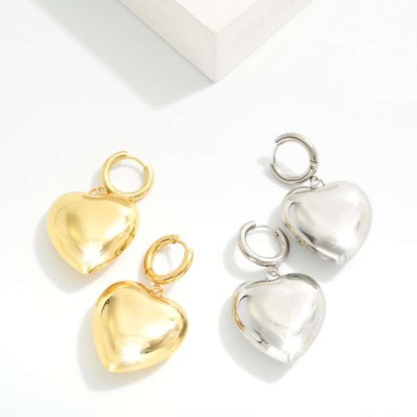 Metal Tone Hoop & Large Puffy Heart Drop Earrings 

- Stainless Steel
- Water Resistant
- Approximately 2" L
