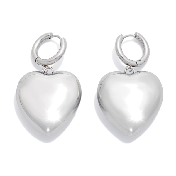 Metal Tone Hoop & Large Puffy Heart Drop Earrings 

- Stainless Steel
- Water Resistant
- Approximately 2" L