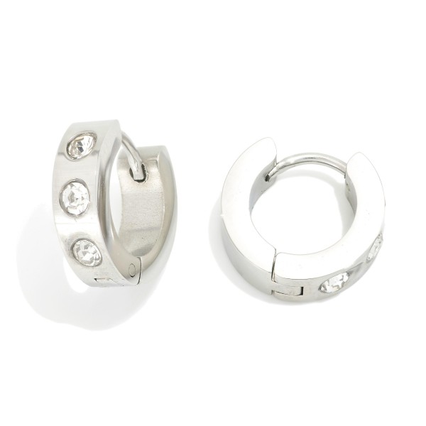 Metal Tone Hinged Huggie Hoop Earrings With Rhinestone Details 

- Stainless Steel
- Water Resistant
- Approximately .25" D