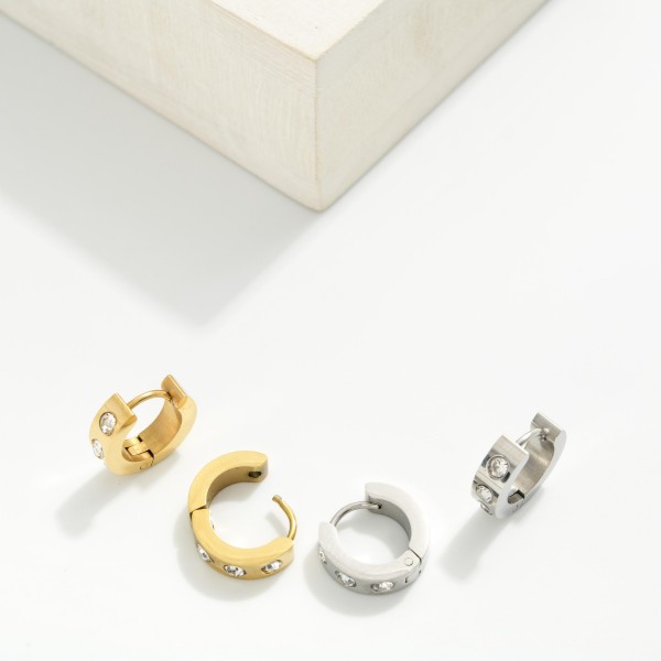 Metal Tone Hinged Huggie Hoop Earrings With Rhinestone Details 

- Stainless Steel
- Water Resistant
- Approximately .25" D