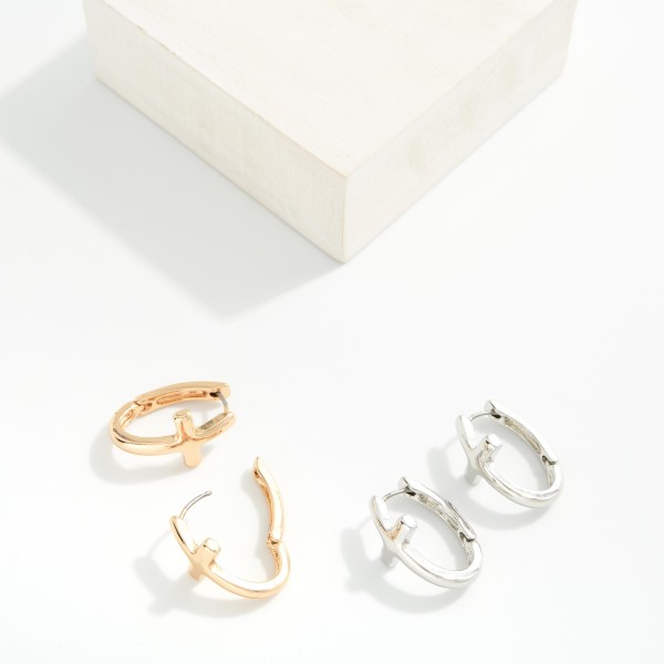 Metal Tone Oval Hoop Cross Earrings 

- Approximately 1" L