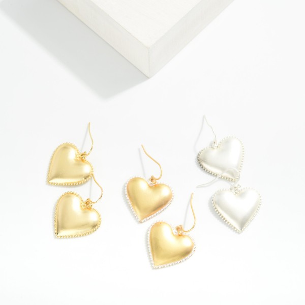 Puffy Metal Tone Heart Earrings Featuring Studded Edge Detail 

- Approximately 1" L