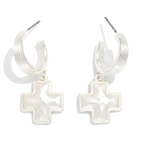 Metal Tone Half Hoop Earrings Featuring Cross Dangle Detail 

- Approximately 1.05" L 
