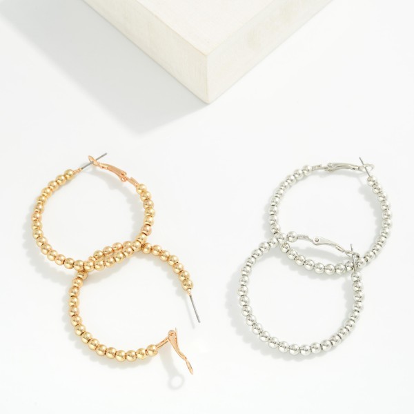 Metal Tone Beaded Hoop Earrings 

- Approximately 1.5" D