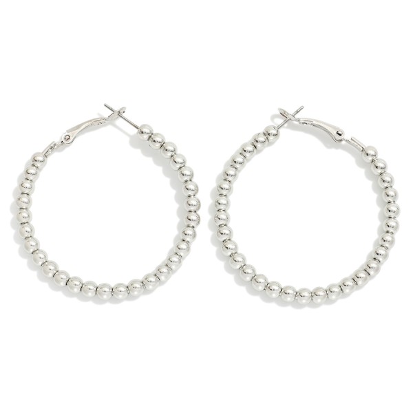 Metal Tone Beaded Hoop Earrings 

- Approximately 1.5" D