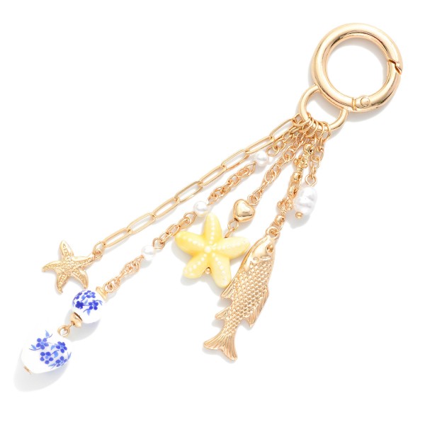 Gold Tone Bag Charm Featuring Sea Charm & Chinoiserie Beads 

- Approximately 4" L