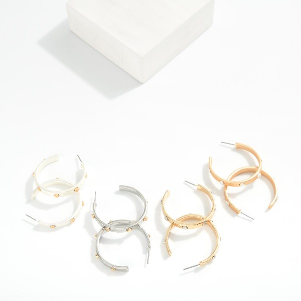 Metal Tone Hoop Earrings Featuring Metal Stud Detail 

- Approximately 1.5" D

