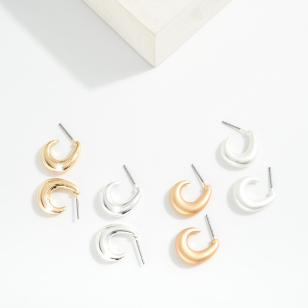 Metal Tone Tapered Teardrop Hoop Earrings 

- Approximately .5" D