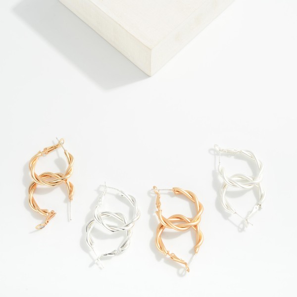 Twisted Metal Hoop Earrings

- Approximately .75" D
