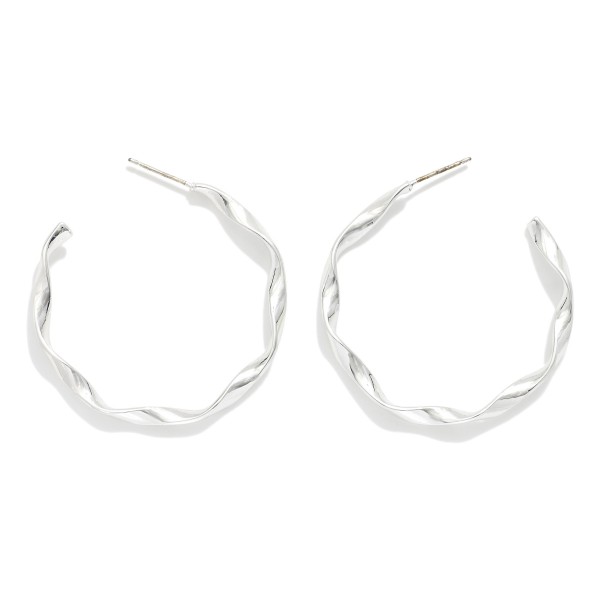 Twisted Metal Hoop Earrings 

- Approximately 1.5" D