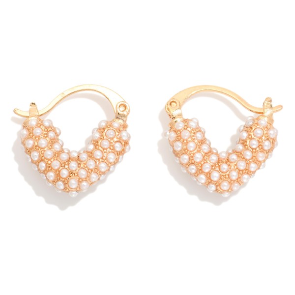 Meatl Tone Puffy Heart With Pearl Detail

- Approximately .75" L 