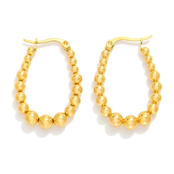Graduated Metal Tone Beaded Oval Hoop Earrings

- Stainless Steel
- Water Resistant
- Approximately .75" D