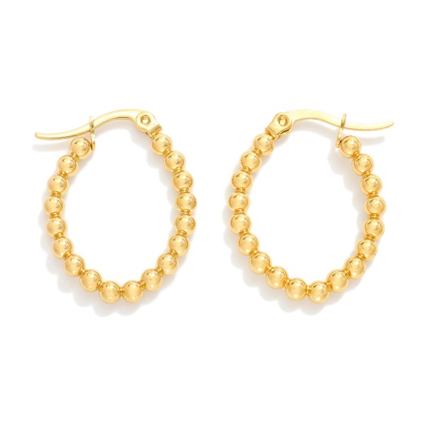 Metal Tone Beaded Oval Hoop Earrings

- Stainless Steel
- Water Resistant
- Approximately .5" D