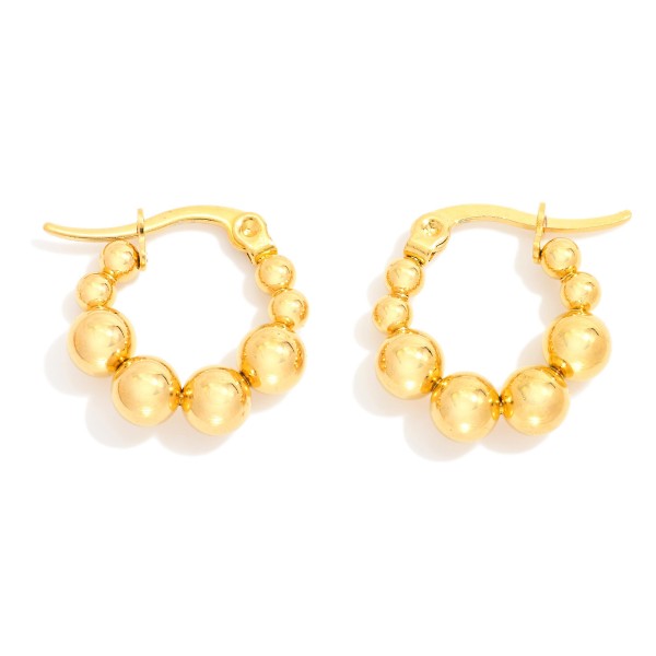 Graduated Metal Tone Beaded Hoop Earrings

- Stainless Steel
- Water Resistant
- Approximately .5" D