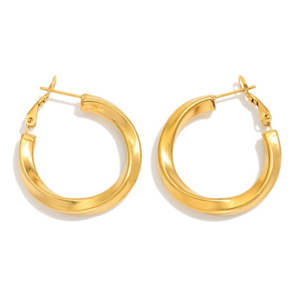 Twisted Metal Tone Huggie Hoop Drop Earring 

- Approximately 1" D 
- Water Resistant 
-Hypoallergenic 
- Stainless Steel 