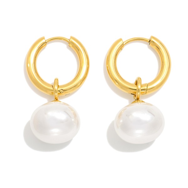 Metal Tone Hoop Earrings Featuring Pearl Dangle Detail 

- Stainless Steel 
- Approximately 1" L