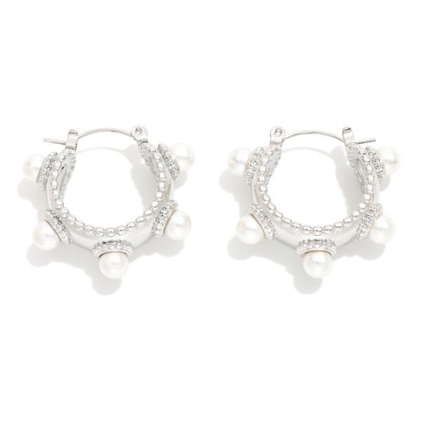 Textured Metal Tone Hoop Earrings Featuring Studded Pearl Details 

- Stainless Steel
- Water Resistant
- Approximately .75" D