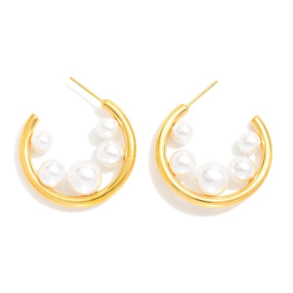 Metal Tone Hoop Earrings Featuring Graduated Pearl Detail 

- Approximately 1" D 