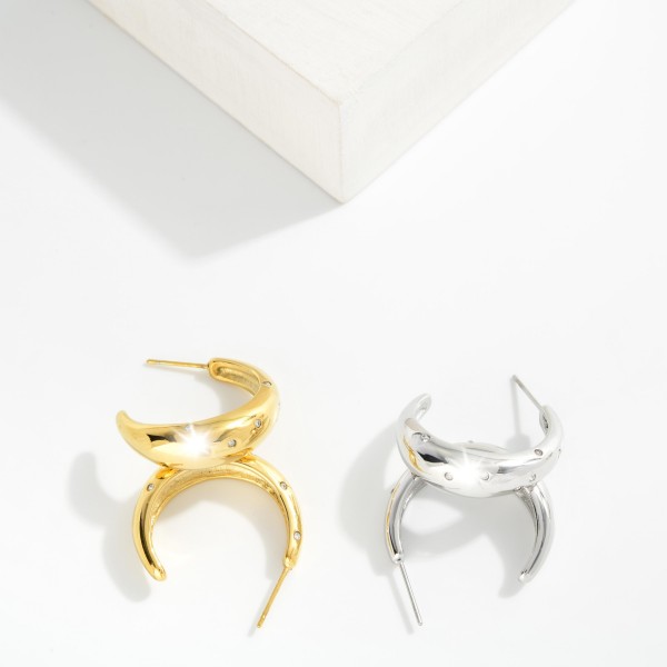 Metal Tone Half Hoop Drop Earring Featuring Rhinestones 

- Approximately 1" L 
- Hypoallergenic
- Stainless Steel 
- Water Resistance 