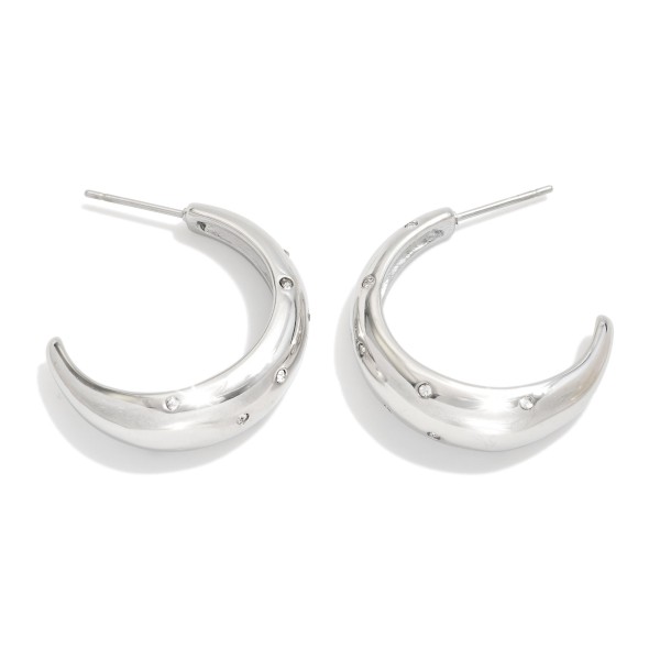 Metal Tone Half Hoop Drop Earring Featuring Rhinestones 

- Approximately 1" L 
- Hypoallergenic
- Stainless Steel 
- Water Resistance 