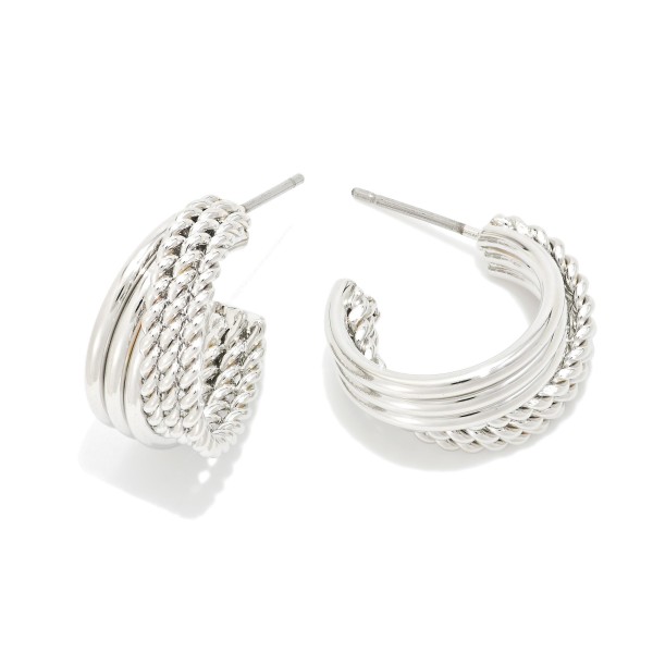 Metal Tone Intertwined Hoop Drop Earrings 

- Approximately .50" D 
