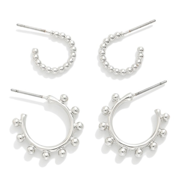 Set Of Two Metal Tone Hoop Drop Earrings 

- Approximately .5" - .75" D 