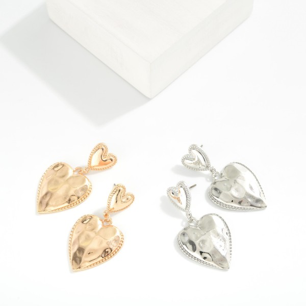 Metal Tone Chain Link Hammered Heart Drop Earrings Featuring Ribb Border Detail 

- Approximately 2" L  