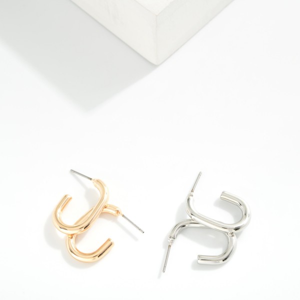 Metal Tone Oval Hoop Earrings 

- Approximately .75" L 