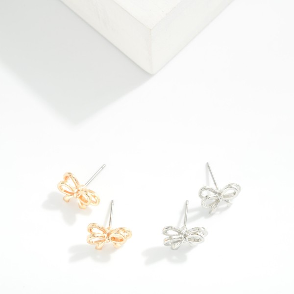 Metal Tone Bow Stud Earrings 

- Approximately .5" L 
