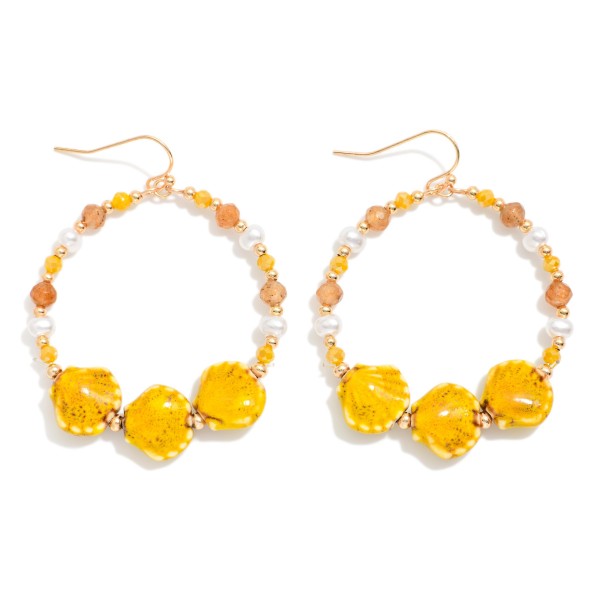 Metal Wire Hoop Earring Featuring Gold Tones, Faceted Beads, Pearls, And Porcelain Shell Beads 

- Approximately 2.5" L 
