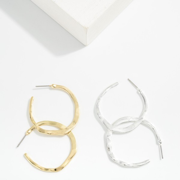 Wavy Flat Metal Tone Hoop Drop Earring 

- Approximately 1.5" D 