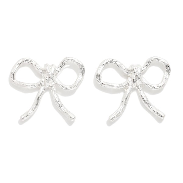 Metal Tone Bow Stud Earrings

- Approximately 1.5" L 