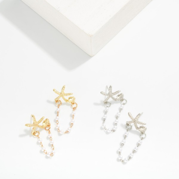Metal Tone Starfish Post Drop Earring Featuring Linked Pearl Dangle Details 

- Approximately 1.5" L
