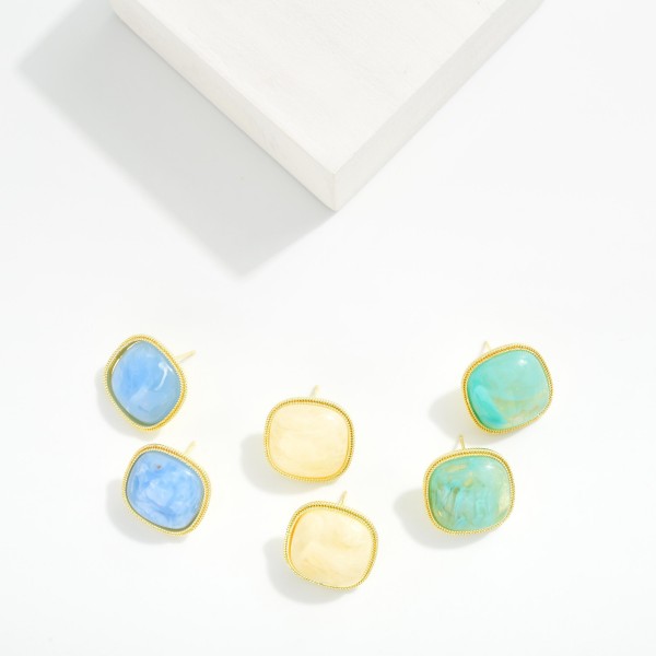 Natural Stone Post Drop Earring Featuring Metal Tone Border 

- Approximately .50" D 
