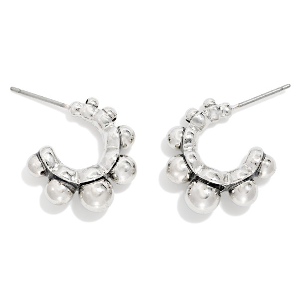 Metal Tone Graduated Bead Hoop Earrings 

- Approximately .5" D