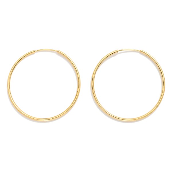 Metal Tone Wire Hoop Earrings 

- Gold Filled
- Approximately 1.5" D