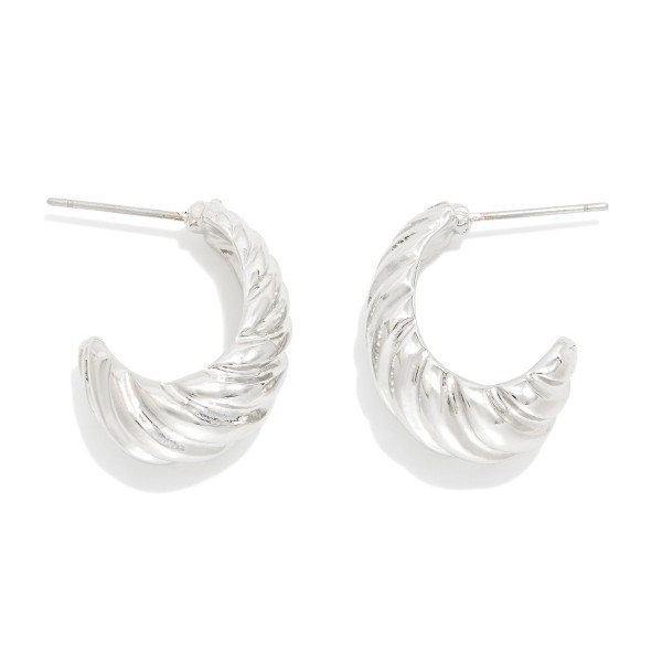 Metal Tone Ribbed Tapered Hoop Earrings 

- Approximately .75" D