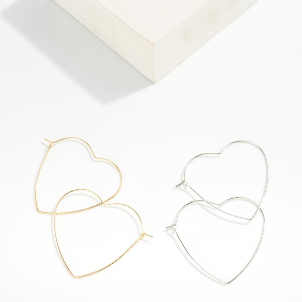Metal Tone Wire Heart Hoop Earrings 

- Approximately 1.5" D