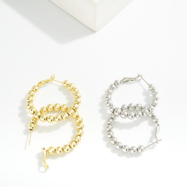 Metal Tone Beaded Hoop Earrings 

- Gold Dipped
- Approximately 1" D
