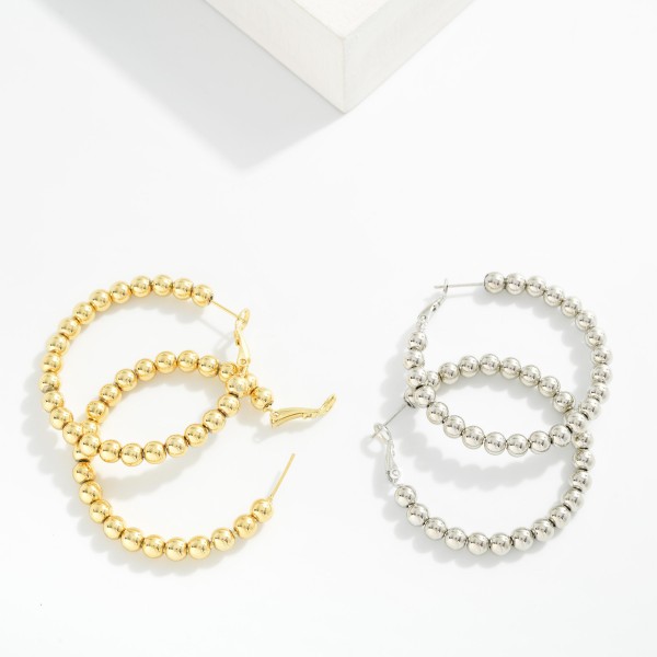 Metal Tone Beaded Hoop Earrings 

- Gold Dipped
- Approximately 1.5" D