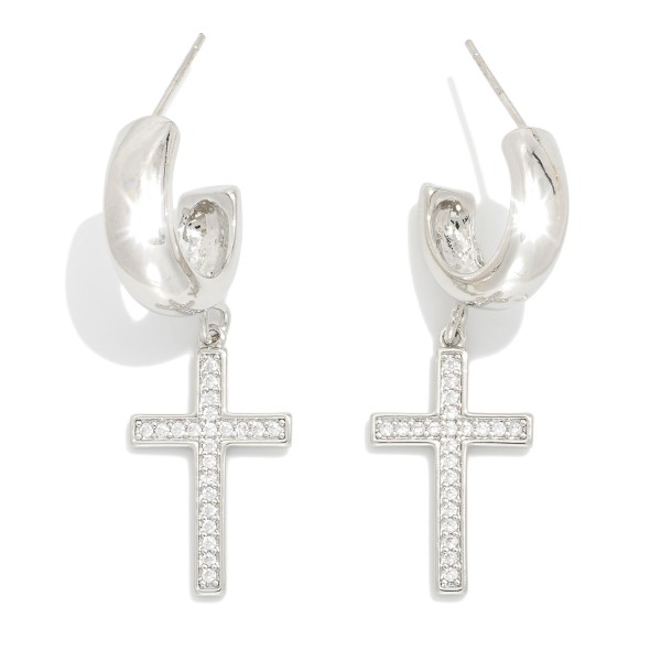 Metal Tone Hoop Earrings Featuring Cubic Zirconia Cross Dangle 

- Gold Dipped
- Approximately 1.25" L