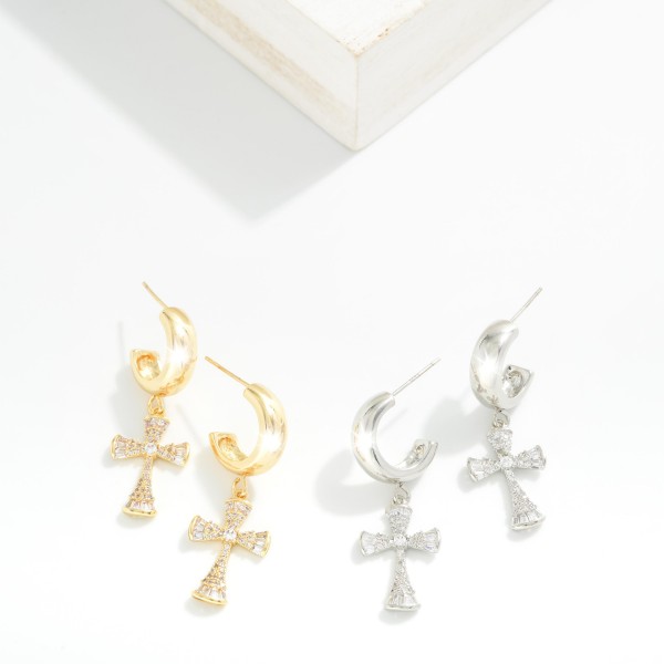 Metal Tone Hoop Earrings Featuring Cubic Zirconia Cross Dangle 

- Gold Dipped
- Approximately 1" L
