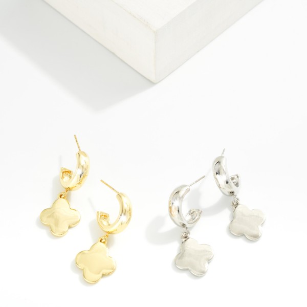 Metal Tone Hoop Earrings With Clover Dangle

- Gold Dipped 
- Approximately 1.5" L