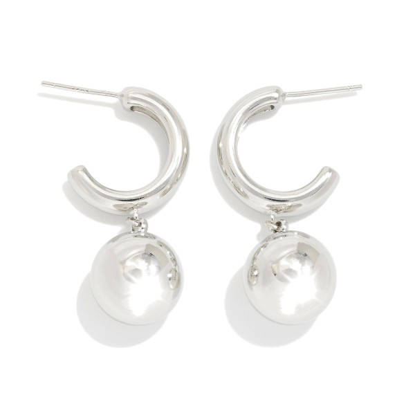 Metal Tone Hoop Earrings Featuring Ball Dangle Detail 

- Gold Dipped 
- Approximately 1" L