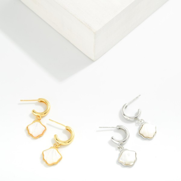 Metal Tone Hoop Earrings Featuring Pearl Shell Dangle Detail 

- Gold Dipped 
- Approximately 1" L