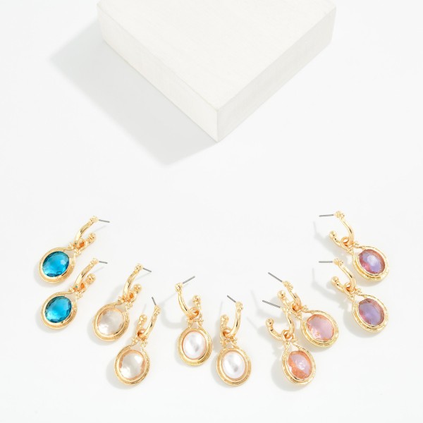 Metal Tone Hoop Earring Featuring Glass Crystal Dangle Detail 

- Approximately 1.5" L 