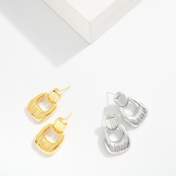 Textured Metal Tone Door Knocker Rectangular Hoop Drop Earrings

- Approximately 1." L 
- Gold Dipped
- Brass Base 
- Hypoallergenic