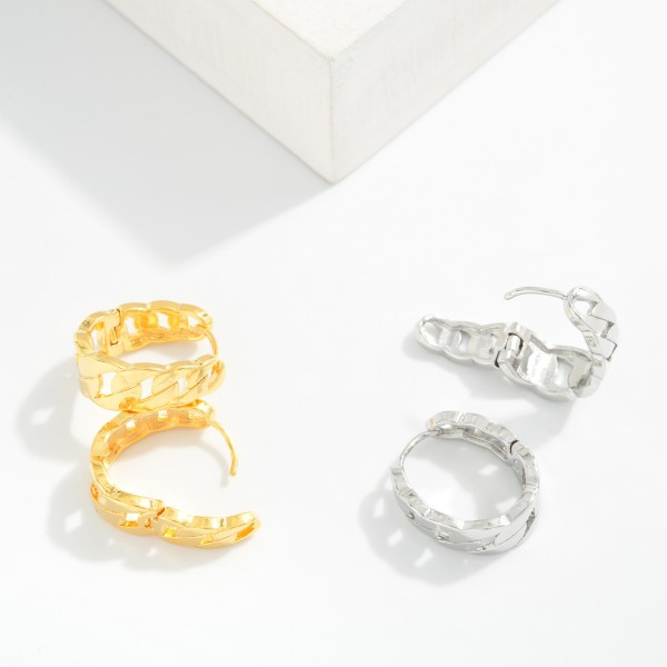 Metal Tone Chain Link Oval Huggie Hoop Drop Earrings 

- Approximately 1." D 
- Gold Dipped
- Brass Base 
- Hypoallergenic