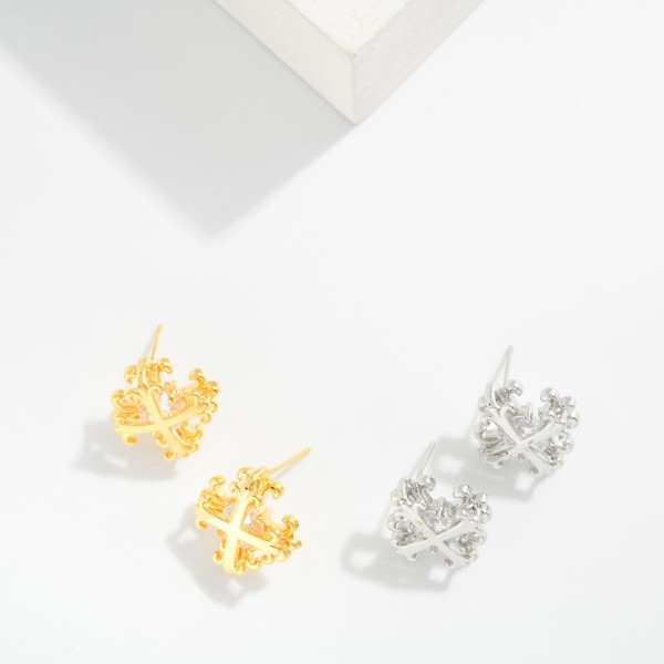 Metal Tone Plus Cross Earring Featuring Cubic Zirconia 

- Approximately 1." D 
- Gold Dipped
- Brass Base 
- Hypoallergenic
